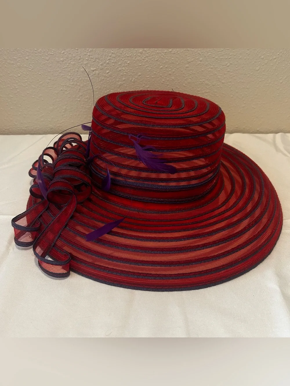 Elegant Red Wide-Brim Dress Hat with Purple Feather Trim